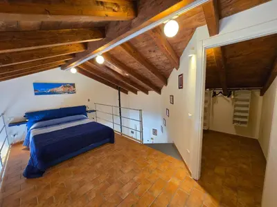 Letto o letti in una camera di Appartamento OM Ponente