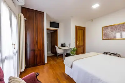 Letto o letti in una camera di Due Maestà Home