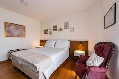 Letto o letti in una camera di Due Maestà Home