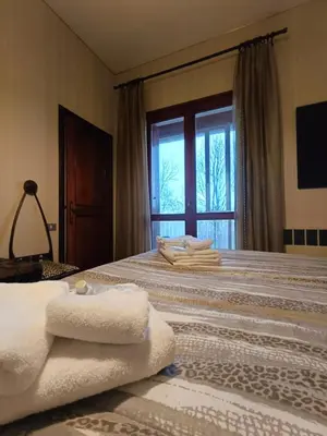 Letto o letti in una camera di Villa Giordani affittacamere Boscoreale