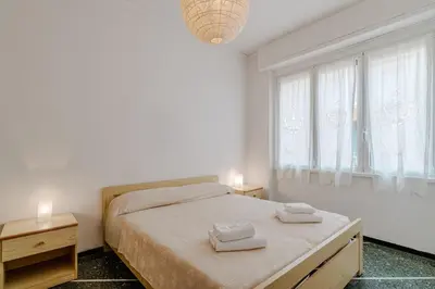 Letto o letti in una camera di GuestHost - Bright Apartment Rapallo