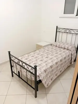 Letto o letti in una camera di Casa Marisa