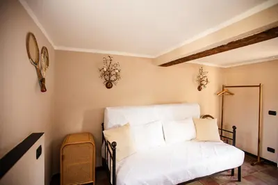 Letto o letti in una camera di Castello Canevaro