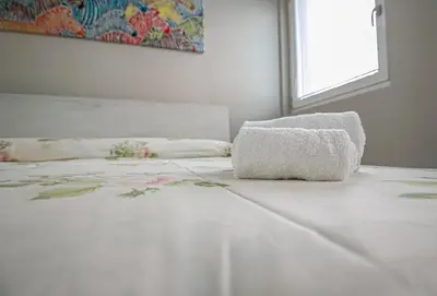Letto o letti in una camera di Nel cuore di Pavia -a pochi passi dalla stazione e dal centro