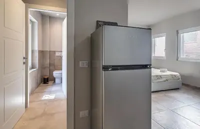 Letto o letti in una camera di Nel cuore di Pavia -a pochi passi dalla stazione e dal centro