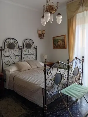 Letto o letti in una camera di B&B Assereto