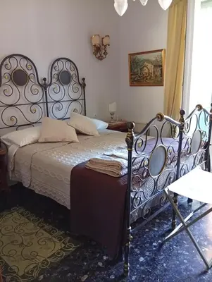 Letto o letti in una camera di B&B Assereto