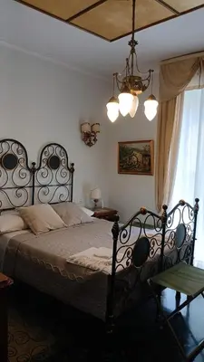 Letto o letti in una camera di B&B Assereto