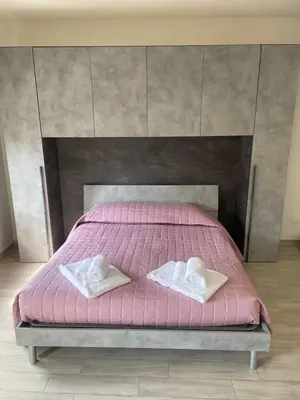 Letto o letti in una camera di Le dimore di Genny 1