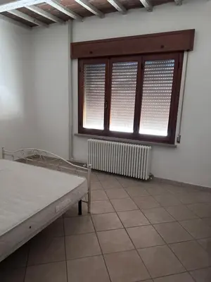 Letto o letti in una camera di Casa Rosa Luzzara