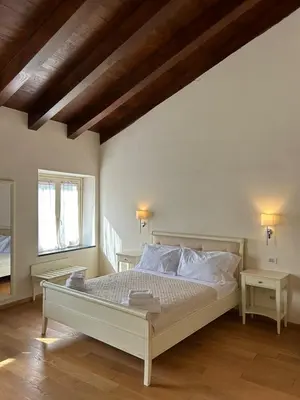 Letto o letti in una camera di Albergo Palazzo Costa