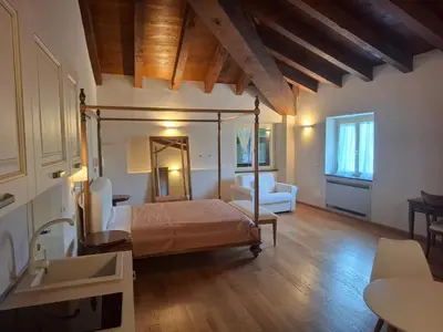 Letto o letti in una camera di Albergo Palazzo Costa