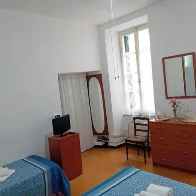 Letto o letti in una camera di Casa Milanesi