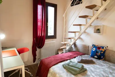 Letto o letti in una camera di Casa Ottilia