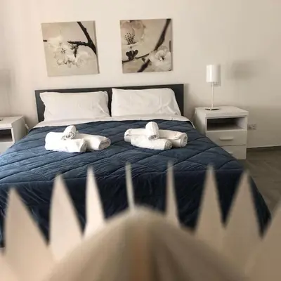 Letto o letti in una camera di Italian Experience-Casa Alessia