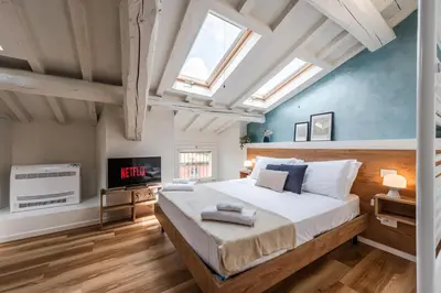 Letto o letti in una camera di Giardini 411 Rooms