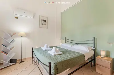 Letto o letti in una camera di Ape Maia, TerreMarine