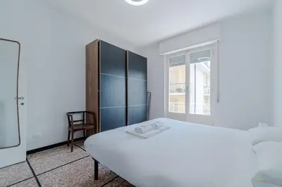 Letto o letti in una camera di GuestHost - Brigh Apartment X5 in Riviera Ligure