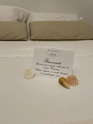 Letto o letti in una camera di La Casa Bianca by M&G