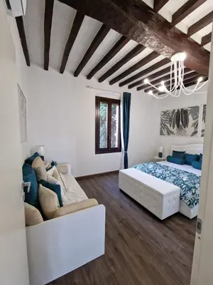 Letto o letti in una camera di Cascina Robusta three-room apartment Box Private parking