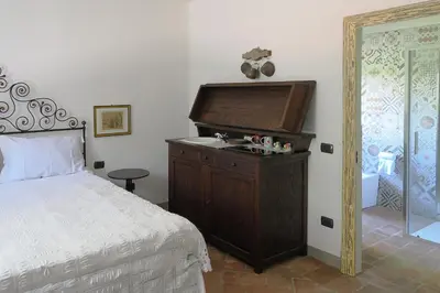 Letto o letti in una camera di Pietra Corva - Monticello Apartments