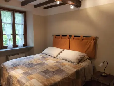Letto o letti in una camera di R&B Piccolo Borgo Tralacosta