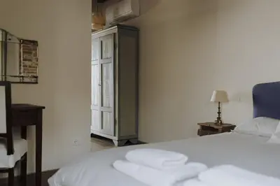 Letto o letti in una camera di Bacialupo Foresteria