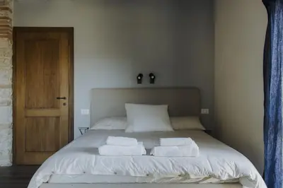 Letto o letti in una camera di Bacialupo Foresteria