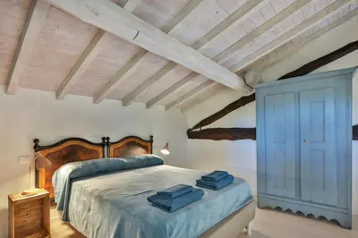 Letto o letti in una camera di Bacialupo Foresteria