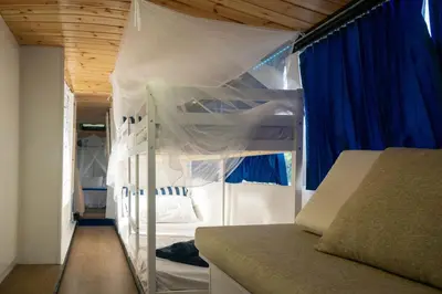 Letto o letti in una camera di Agri Campeggio La Passeggiata solo posti campeggio camper roulotte tende