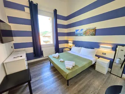 Letto o letti in una camera di Affittacamere Guest House Happy Holiday