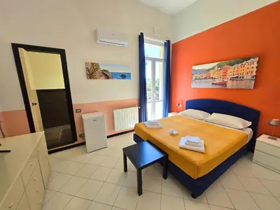 Letto o letti in una camera di Affittacamere Guest House Happy Holiday