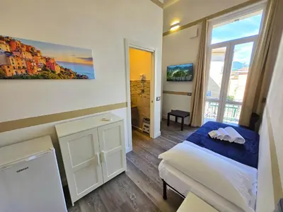 Letto o letti in una camera di Affittacamere Guest House Happy Holiday