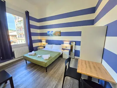 Letto o letti in una camera di Affittacamere Guest House Happy Holiday
