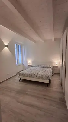 Letto o letti in una camera di Casa Isabel Moneglia
