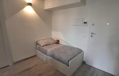Letto o letti in una camera di Casa Isabel Moneglia
