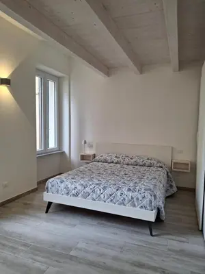 Letto o letti in una camera di Casa Isabel Moneglia