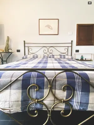 Letto o letti in una camera di Residenza Nemus Vinea Mare e Montagna