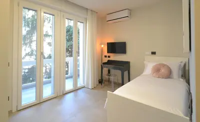 Letto o letti in una camera di CIVICO 8 Reggio Emilia