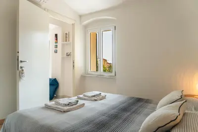 Letto o letti in una camera di La Casetta del Ponte a due passi dal Mare