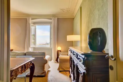 Letto o letti in una camera di Le sorelle - Elegante appartamento fronte mare - 6 posti letto - con posto auto privato