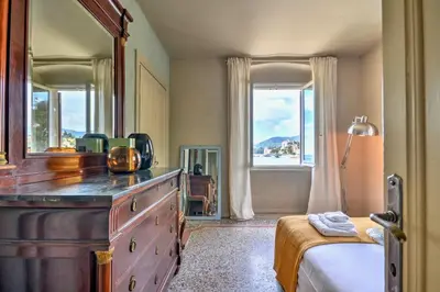 Letto o letti in una camera di Le sorelle - Elegante appartamento fronte mare - 6 posti letto - con posto auto privato