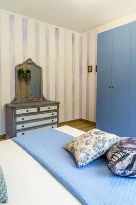 Letto o letti in una camera di Casa Olivieri 05