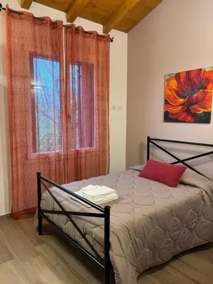 Letto o letti in una camera di Pitaciò Affittacamere