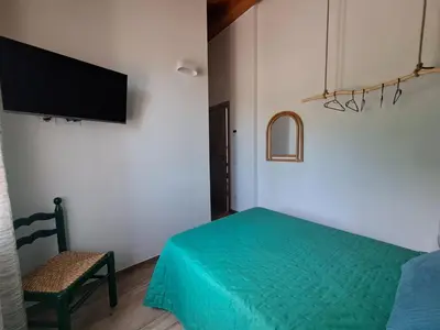 Letto o letti in una camera di Pitaciò Affittacamere