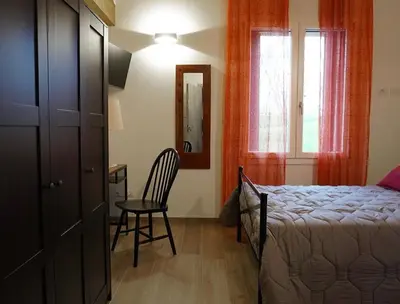 Letto o letti in una camera di Pitaciò Affittacamere