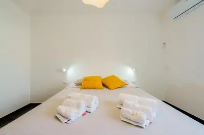 Letto o letti in una camera di the riviera attico terrazza