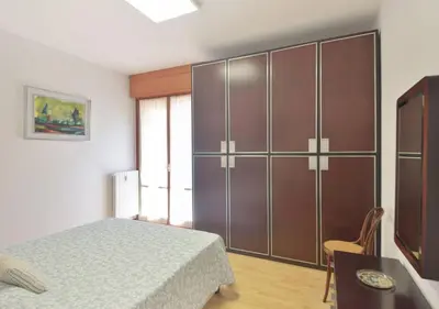 Letto o letti in una camera di Sanguineti Flexyrent apt AC
