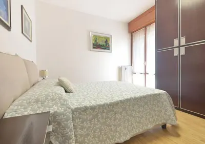 Letto o letti in una camera di Sanguineti Flexyrent apt AC