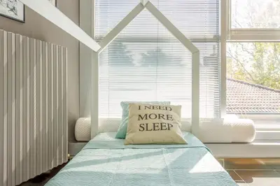 Letto o letti in una camera di Comics & Cars - Themed Penthouse in Motor Valley